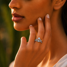 The Royal Crown Ring: Round Solitaire Elegance with Side Diamonds — on-model view
